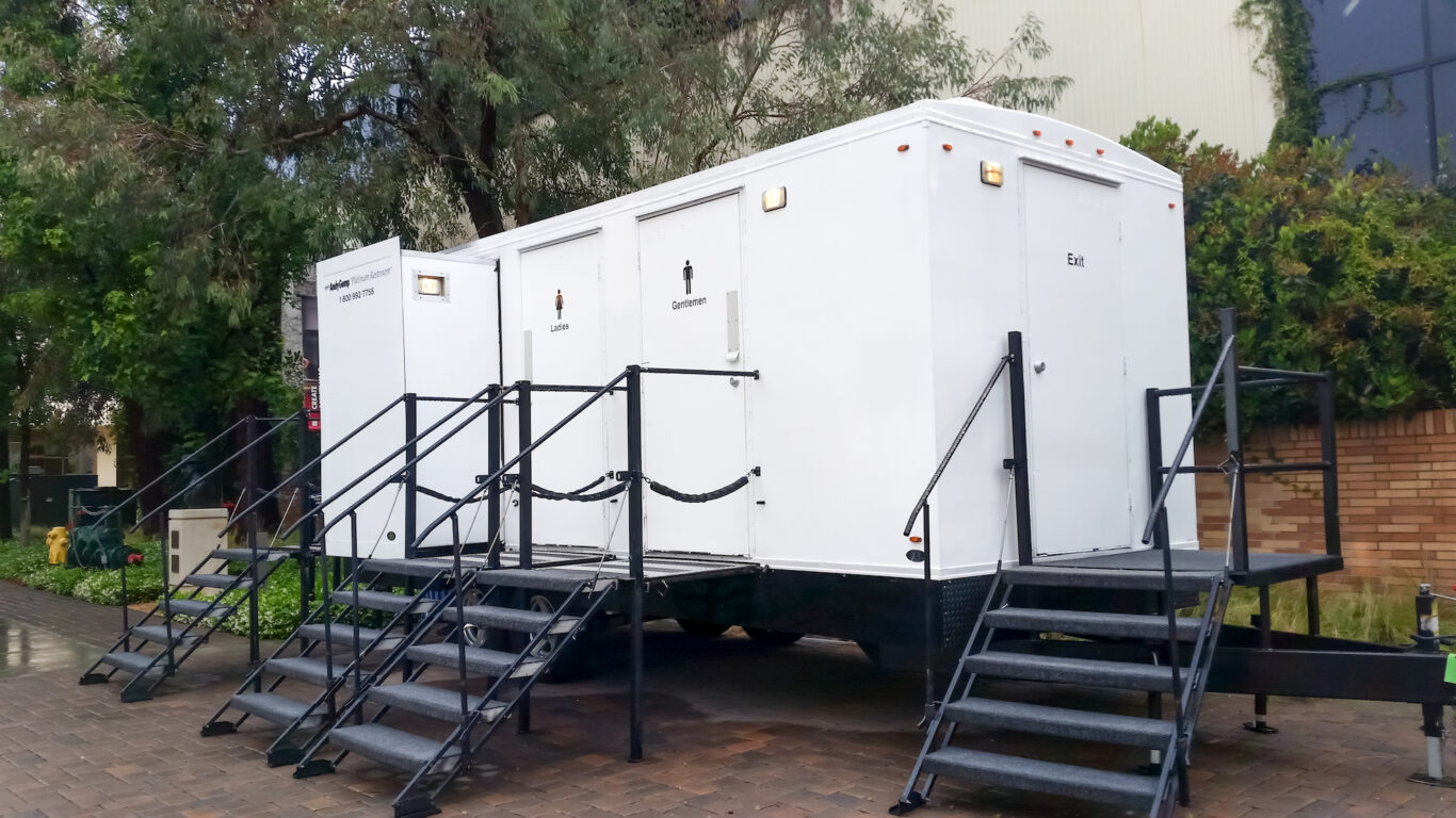 Los Angeles, California, United States - 07-12-2019: A view of a portable restroom trailer at a public event.